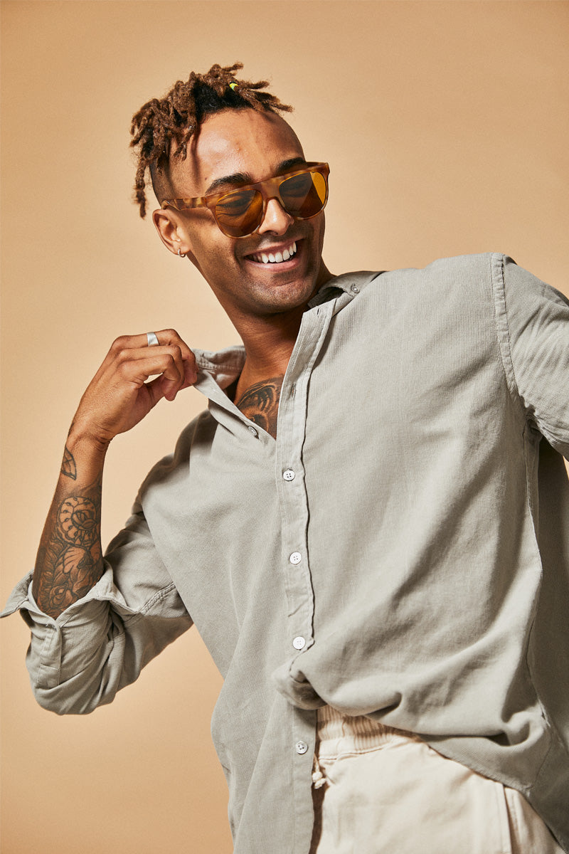 Male model wearing orange polarised sunglasses from Ozeano Vision