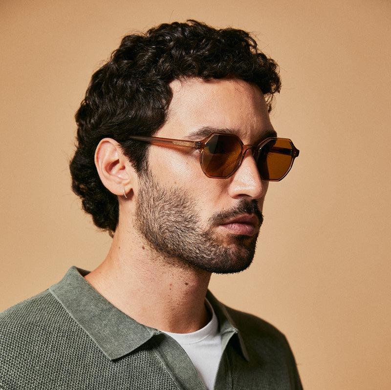 Male model wearing brown polarised sunglasses from Ozeano Vision