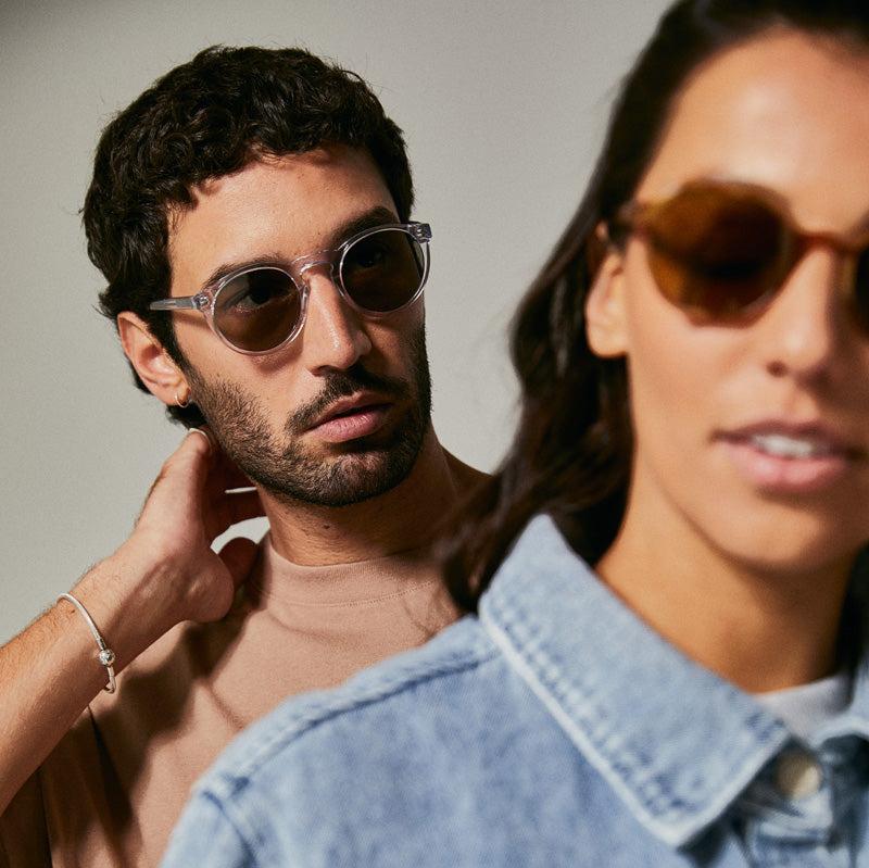 Male model wearing translucent polarised sunglasses